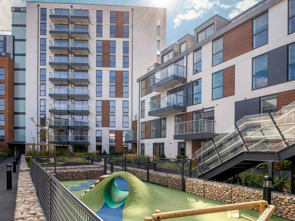 gabiion wall on roof park podium around play area with tunnel