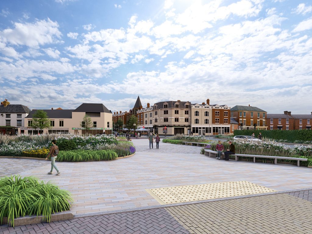 Colwyn  Bay railway station plaza design with stone paving, extensive planting beds and seating with meeting spaces 