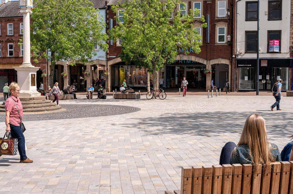 people sitting in Carlisle Market Square
